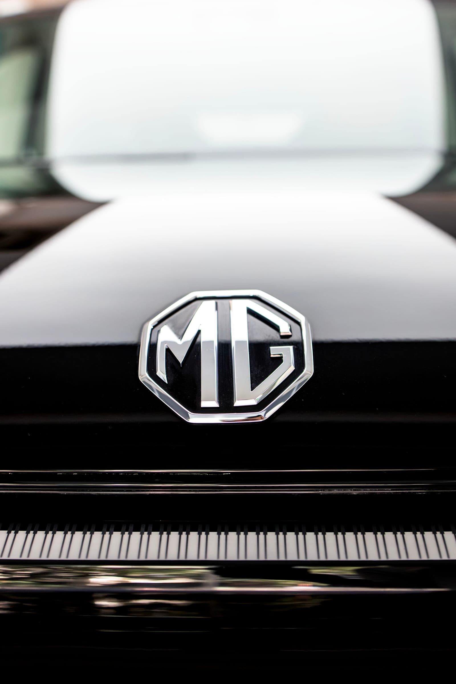 MG badge on the gloss black nose of an MG M9