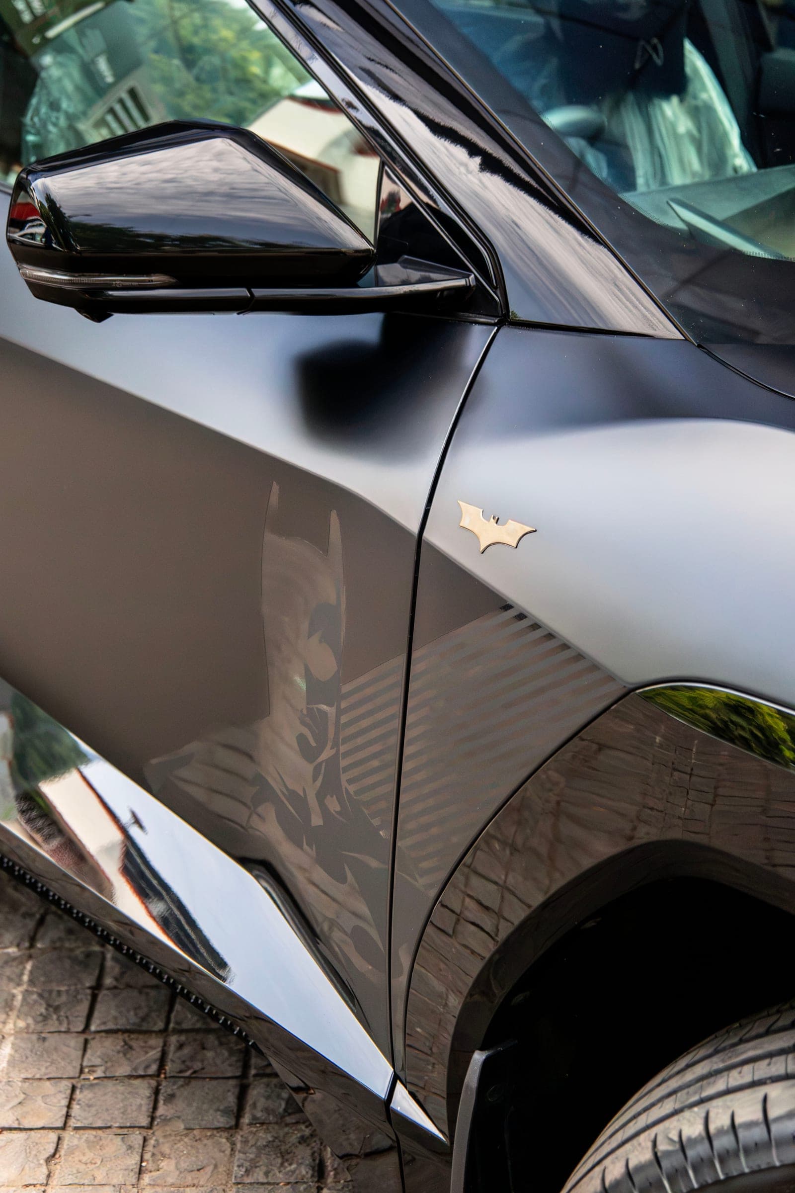 Satin black flank and wheel arch of a Mahindra BE 6