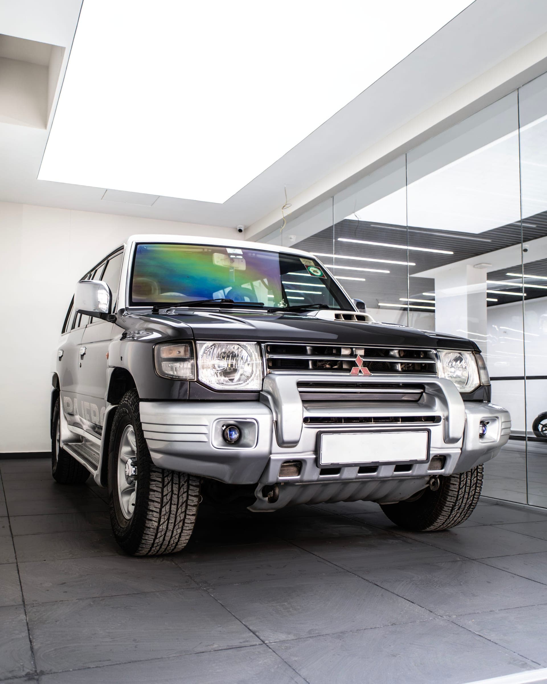 Two-tone black and white Mitsubishi Pajero in the studio