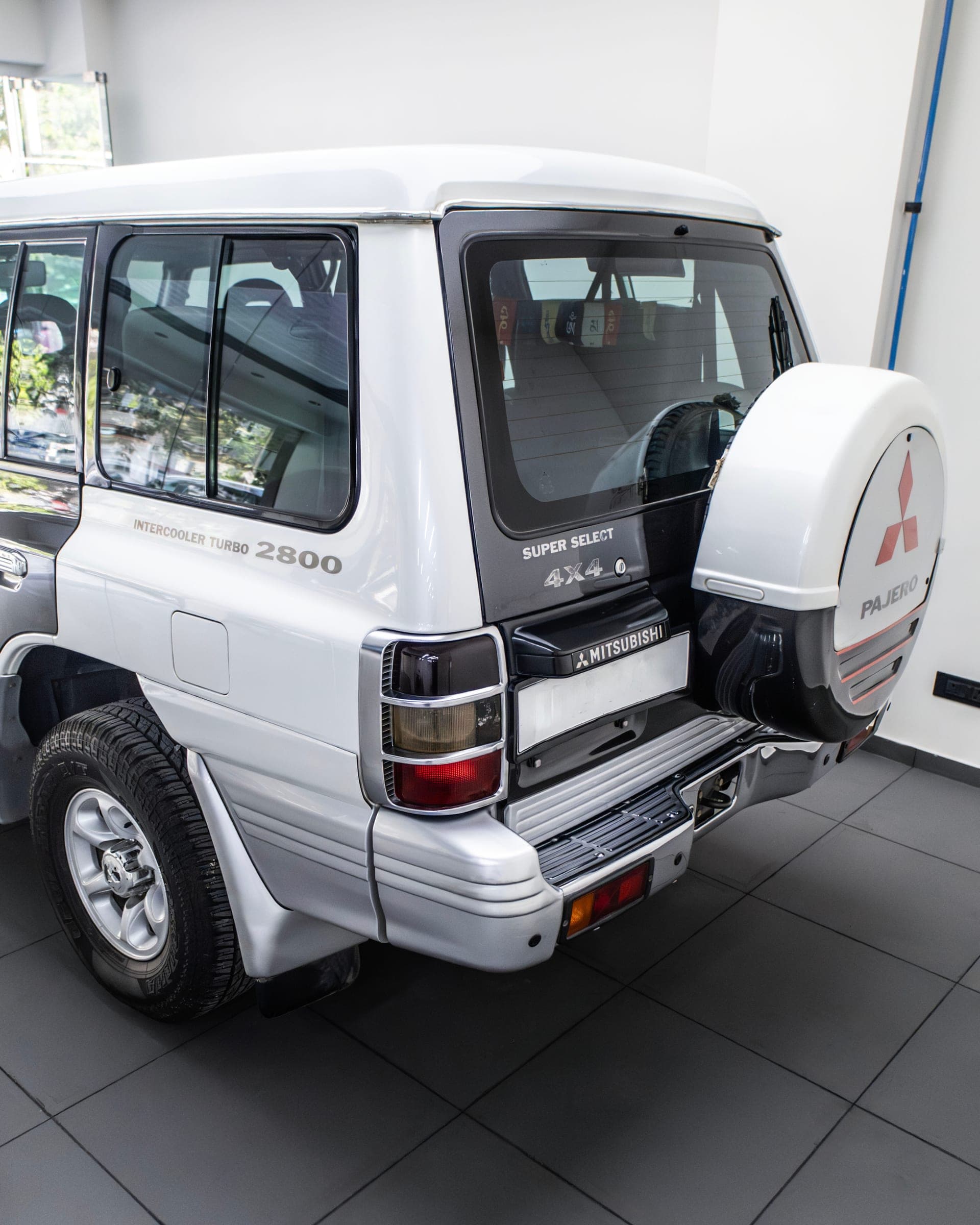 Rear of a Mitsubishi Pajero with its spare-wheel cover