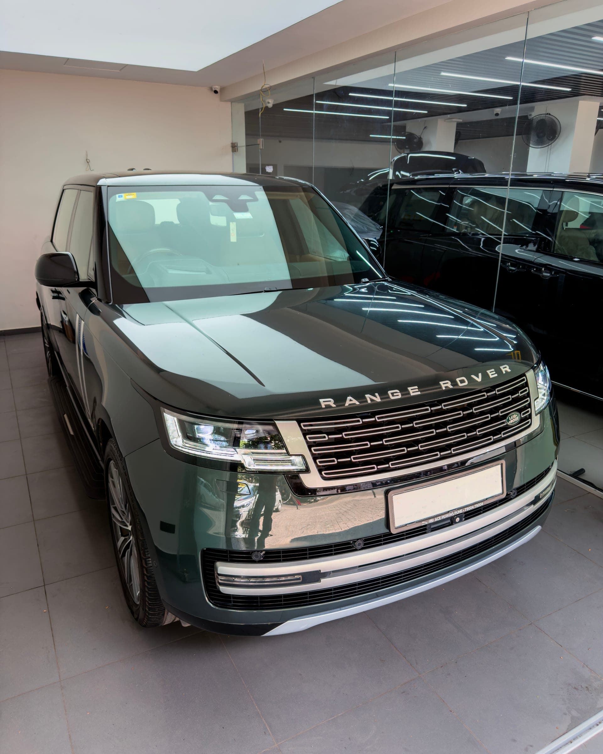 Dark green Range Rover Autobiography in the studio, front three-quarter view